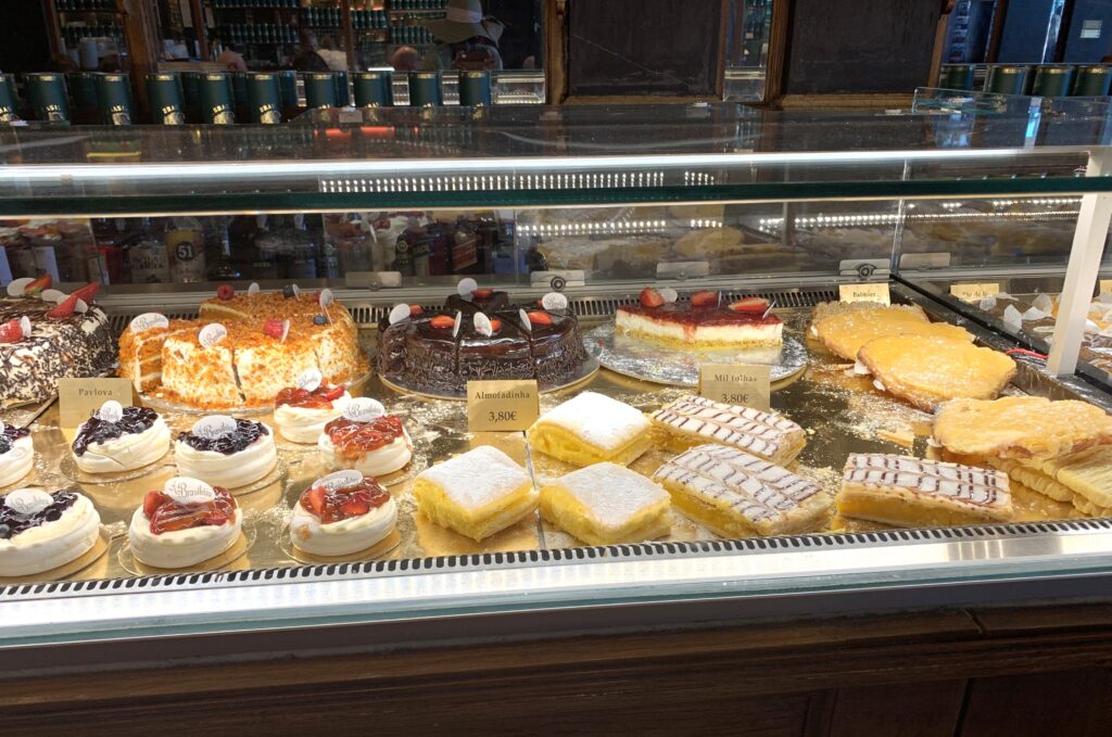 Glass case of pastries and cakes.
