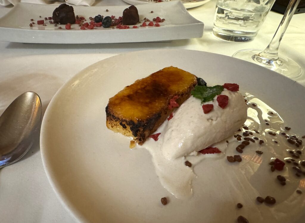 Bruleed sponge cake with a scoop of condensed milk ice cream